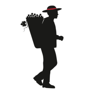 Silhouette einer Person mit Hut, die einen Korb mit Weintrauben auf dem Rücken trägt.
